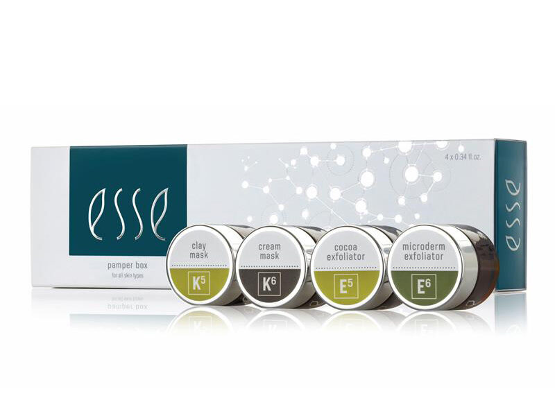 MicrosoftTeams-image A box of Esse skincare products with four small jars displayed in front. The jars are labeled as clay mask (K5), cream mask (K6), cocoa exfoliator (E5), and microderm exfoliator (E6). The packaging is white with green and black accents.